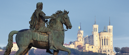 Statue of Louis and Basilique Fourviere on a backgroundの写真素材