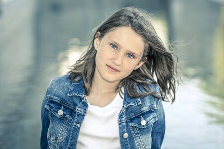 Outdoor portrait of beautiful girl 10-11 year oldの写真素材