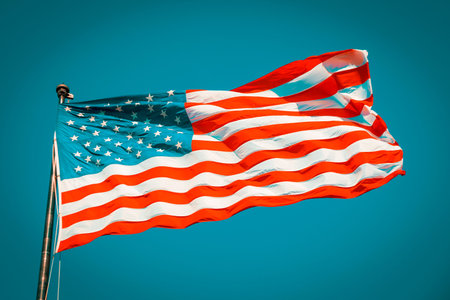 American flag on the blue sky, USA, special photographic processing.
