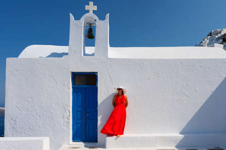Woman in front of church in Santorini, Greeceの写真素材