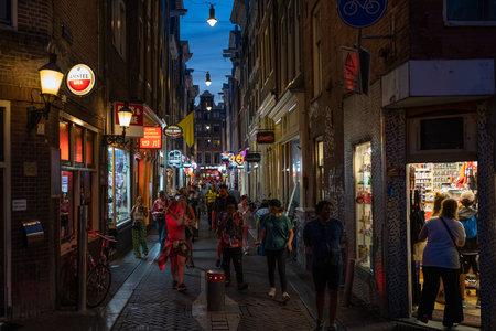 AMSTERDAM, NETHERLANDS - AUGUST 23 2022: the world famous red district in Amsterdam, Netherlandsのeditorial素材