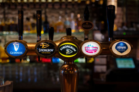 AMSTERDAM, NETHERLANDS - AUGUST 24 2022: draft beer in a bar in Amsterdam, Netherlandsのeditorial素材
