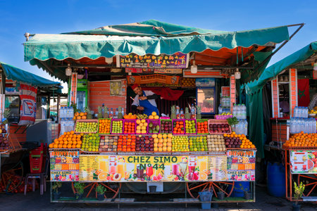 MARRAKECH, MOROCCO - DECEMBER 22, 2022: fruit juice seller in famous Marrakesh square Jema el Fna in Marrakesh, Morocco.のeditorial素材