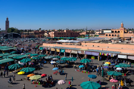 MARRAKECH, MOROCCO - DECEMBER 24, 2022: People walking in famous Marrakesh square Jema el Fna in Marrakesh, Morocco. The square is part of the UNESCO World Heritage.のeditorial素材