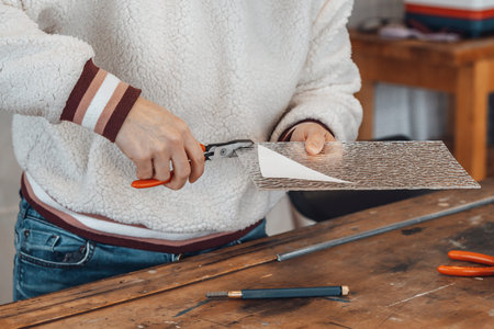 woman master glassmaker at work in a workshop, France