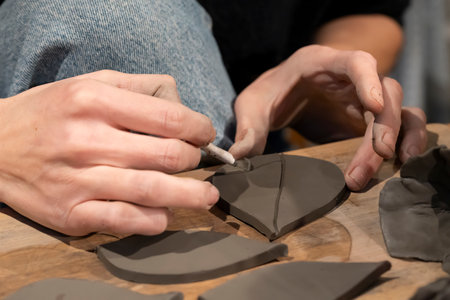 view of potter woman hands at work in workshop in Franceの写真素材