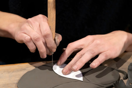 potter woman hands in workshop in Franceの写真素材