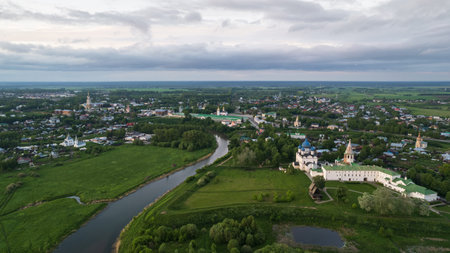 Aerial view panorama of cityscape of the Suzdal Kremlin on a bend of the Kamenka river. Russia,...