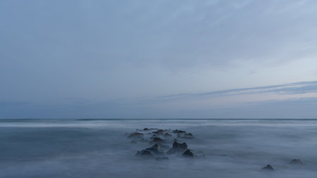 Sea and rocks after sunset. The blue Hour. Photo taken on long exposure. High quality photoの写真素材