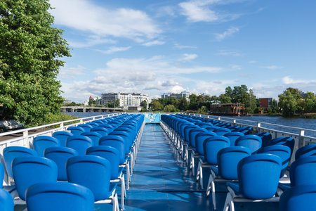 Blue empty plastic chairs on a river cruise ship. High quality photoの写真素材