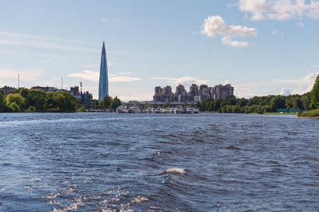 Cityscape of modern Saint Petersburg on a sunny summer day. View from Elaginov Island to the Lakhta Center skyscraper and the Imperial Yacht Club on the Srednyaya Nevka River. High quality photoの写真素材
