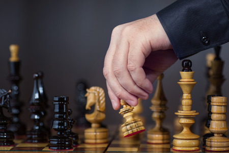 Game in chess. The chess player makes the moveの写真素材