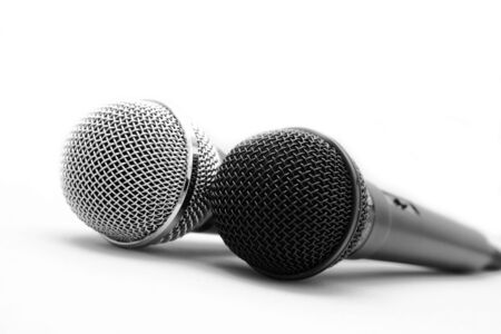 Two professional microphones on a light backgroundの写真素材
