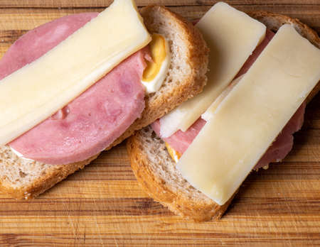 A banana sitting on top of a wooden cutting board. High quality photoの写真素材