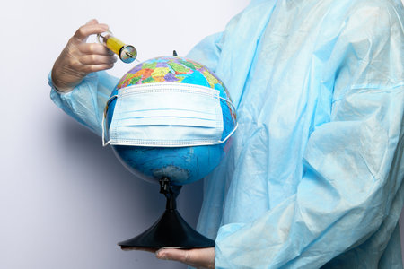 The doctor gives an injection to the globeの写真素材