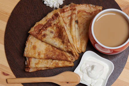 photo pancakes yogurt a cup of coffee on a blackboardの写真素材