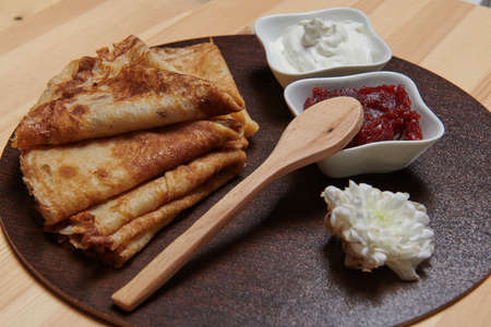pancakes and jam yogurt and white flowerの写真素材