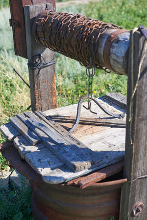 Modern Rustic Wooden Water Extraction Well Rusty Chainの写真素材