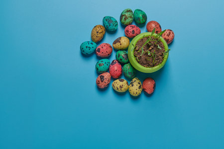 little harshka with young green grass and colored eggs for Easter