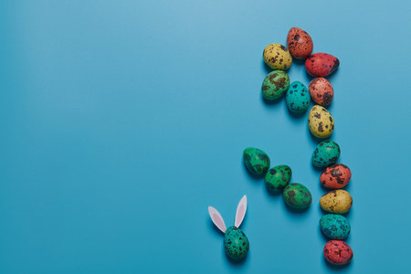 painted eggs laid out in the form of a flowerの写真素材