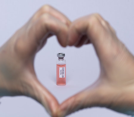 virus vaccine in human finger heart photoの写真素材