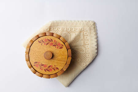 round wooden cup on a napkin isolated on white backgroundの写真素材