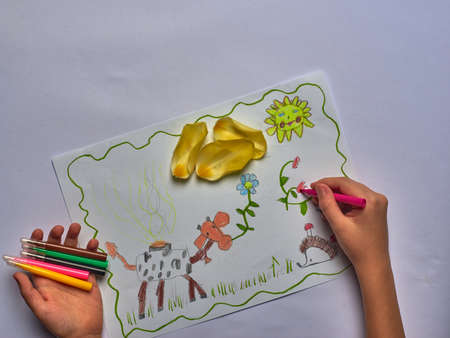 spring childrens drawing with felt-tip pens on white paperの写真素材