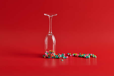 with round multicolored round candies glass upside downの写真素材