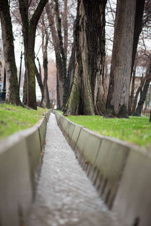 ditch with water after rain in the parkの写真素材