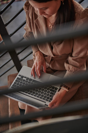 top view of how a girl works on a laptop