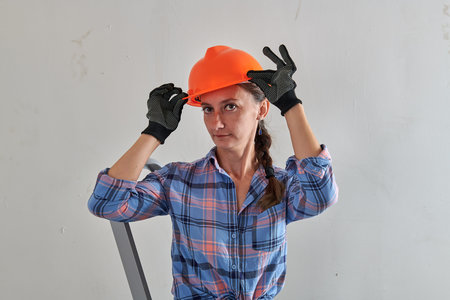 girl wearing black gloves and hard hat