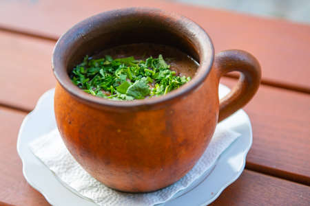 Lobio of red beans in a pot with herbsの写真素材