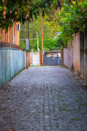 cozy cobbled street in kutaisi in georgiaの写真素材