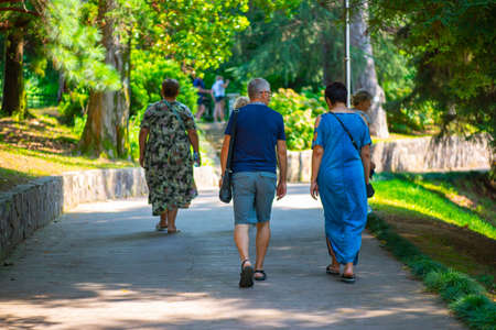 many people walk in the Batumi Botanical Gardenの写真素材