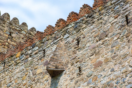 high outer fortification wall with observation windows