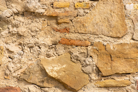 cave wall lined with different colored stones