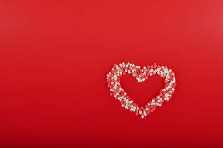 red and white heart on a red backgroundの写真素材