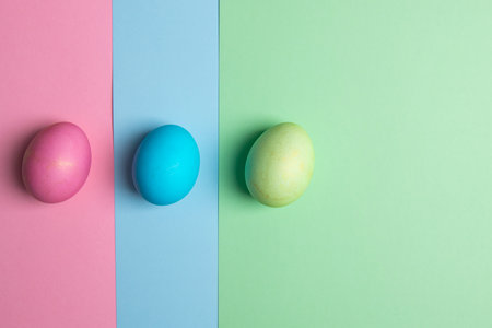 colored eggs lie on three colored backgrounds