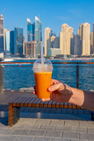 one orange drink is cold and very tastyの写真素材