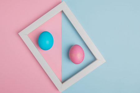 blue and pink easter eggs in a white frame