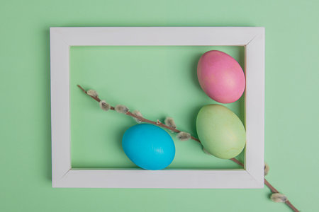 on a green background easter eggs in a white frame