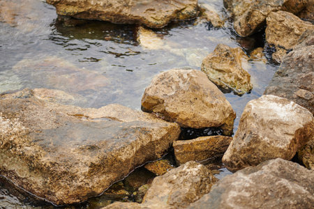 huge stones are washed by the waters of the Bay of Kotor