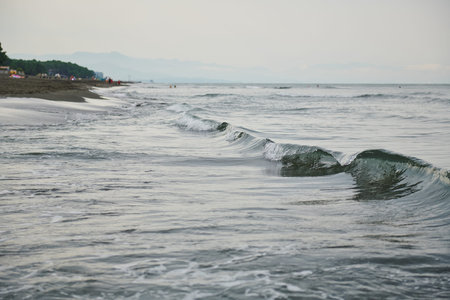 small waves on the black sea during the day in summer