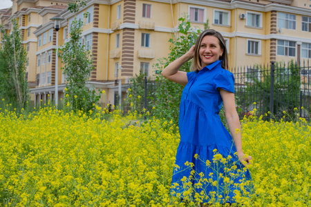 girl in yellow flowers in a blue dress