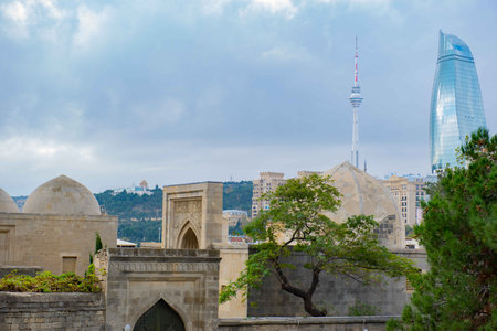 The modern landmark is visible from the old city of Bakuの写真素材
