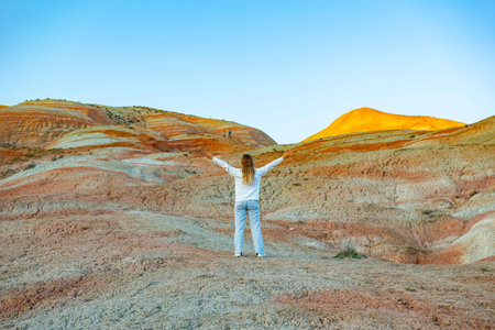Girl walking in the mountains of Khizi at sunsetの写真素材