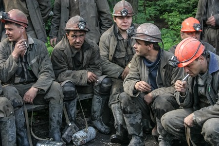 Miners working in anticipation of transport, before sending on changeのeditorial素材