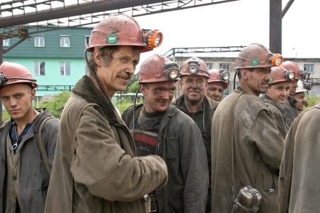 Miners working in anticipation of transport, before sending on changeのeditorial素材