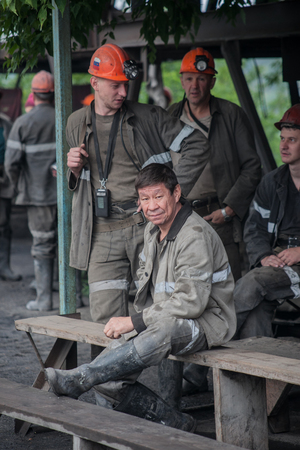 Miners working in anticipation of transport, before sending on changeのeditorial素材