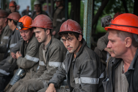 Miners working in anticipation of transport, before sending on changeのeditorial素材